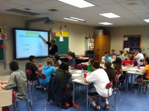 Mrs. Jackie Hoopes, junior high science teacher, instructs students using the feature-rich interactive whiteboard system, which can transform ordinary, lecture-based monologues into dynamic, captivating learning experiences.