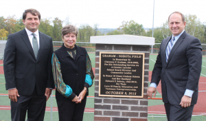 Diane Graham Sobota, along with her sons Michael (left) and Ed, unveiled the new field marker for Graham-Sobota Field on October 9, 2015